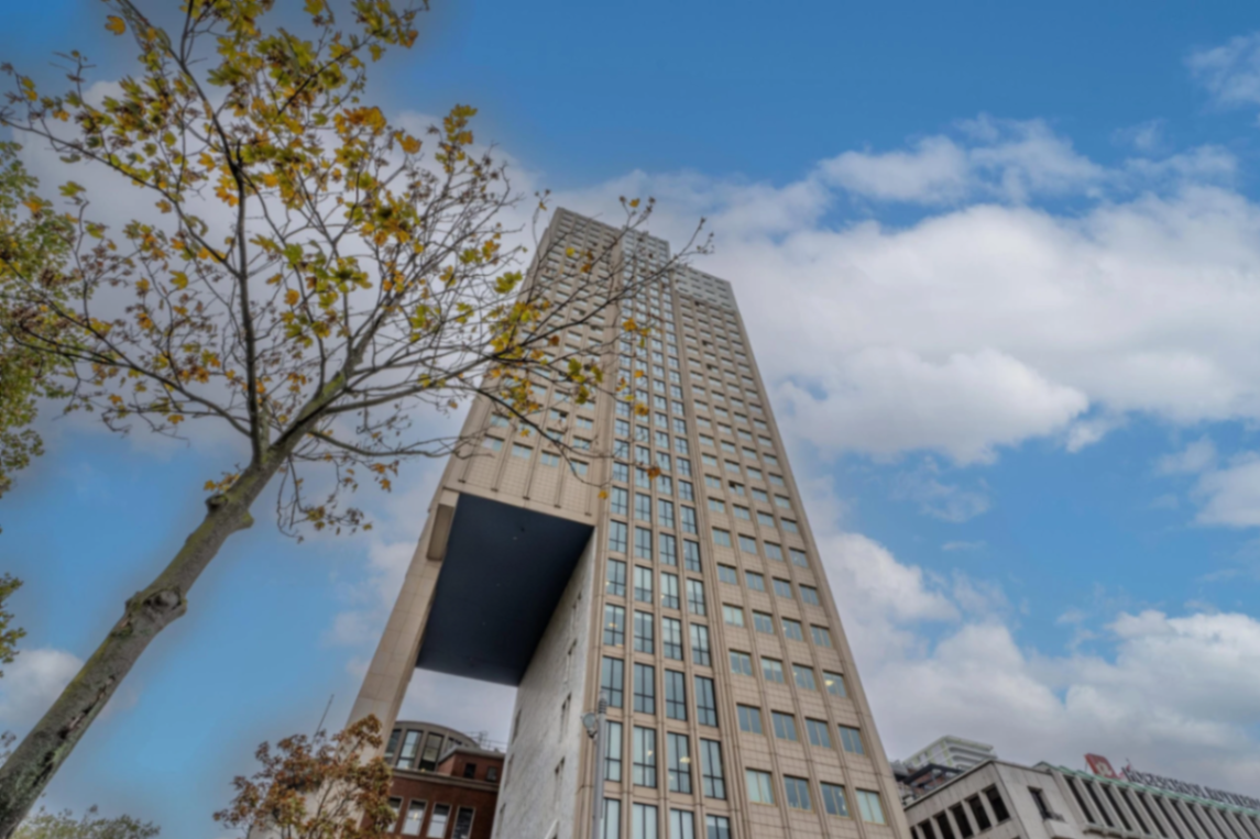 Rotterdam penthouse tower exterior against a blue sky
