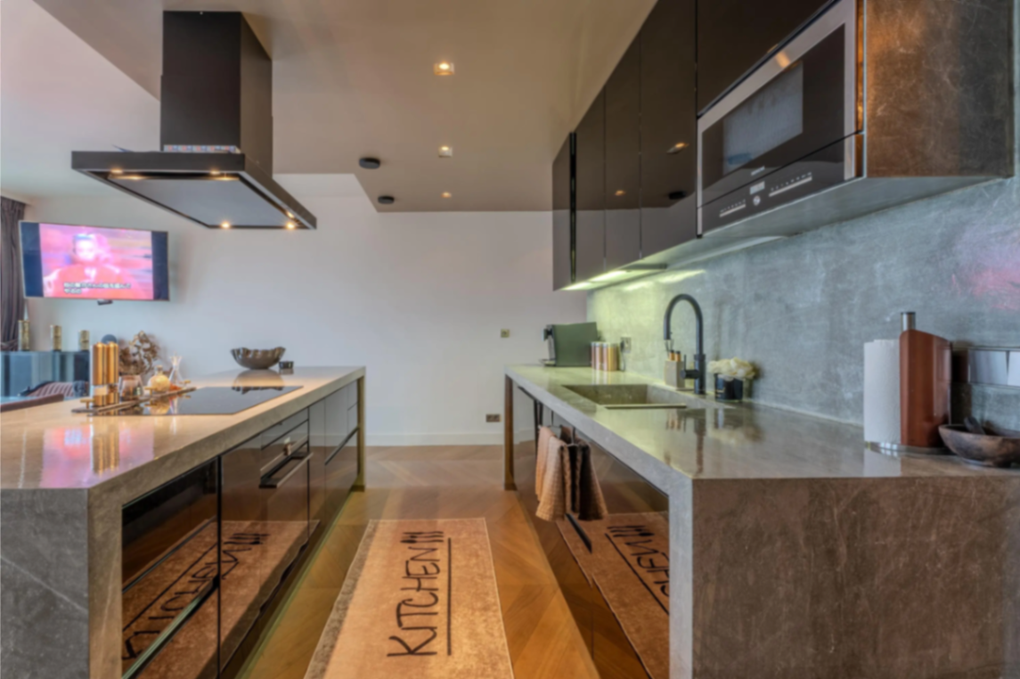 Kitchen detail with stone finishes and integrated island