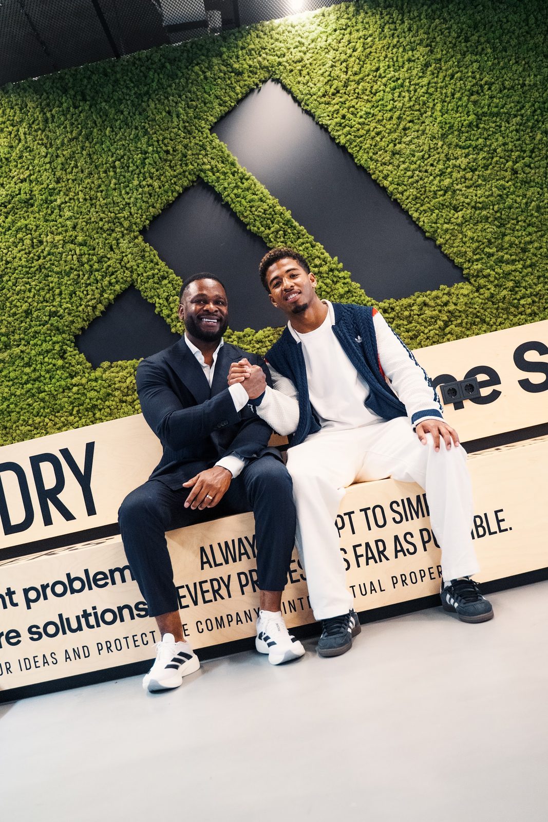 AAM Agency founder shaking hands with Shurandy Sambo at adidas HQ
